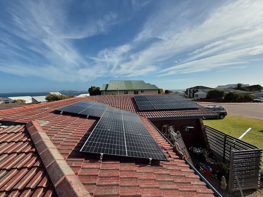 Rooftop solar panel installation across a Perth home